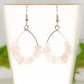 Natural Rose Quartz Crystal Chip Earrings on a tea cup