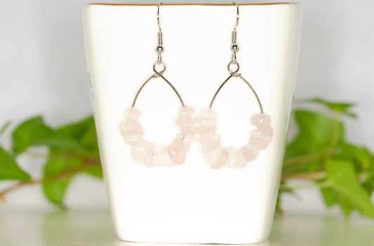 Natural Rose Quartz Crystal Chip Earrings on a tea cup