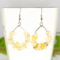 Natural Citrine Crystal Chip Earrings on a tea cup